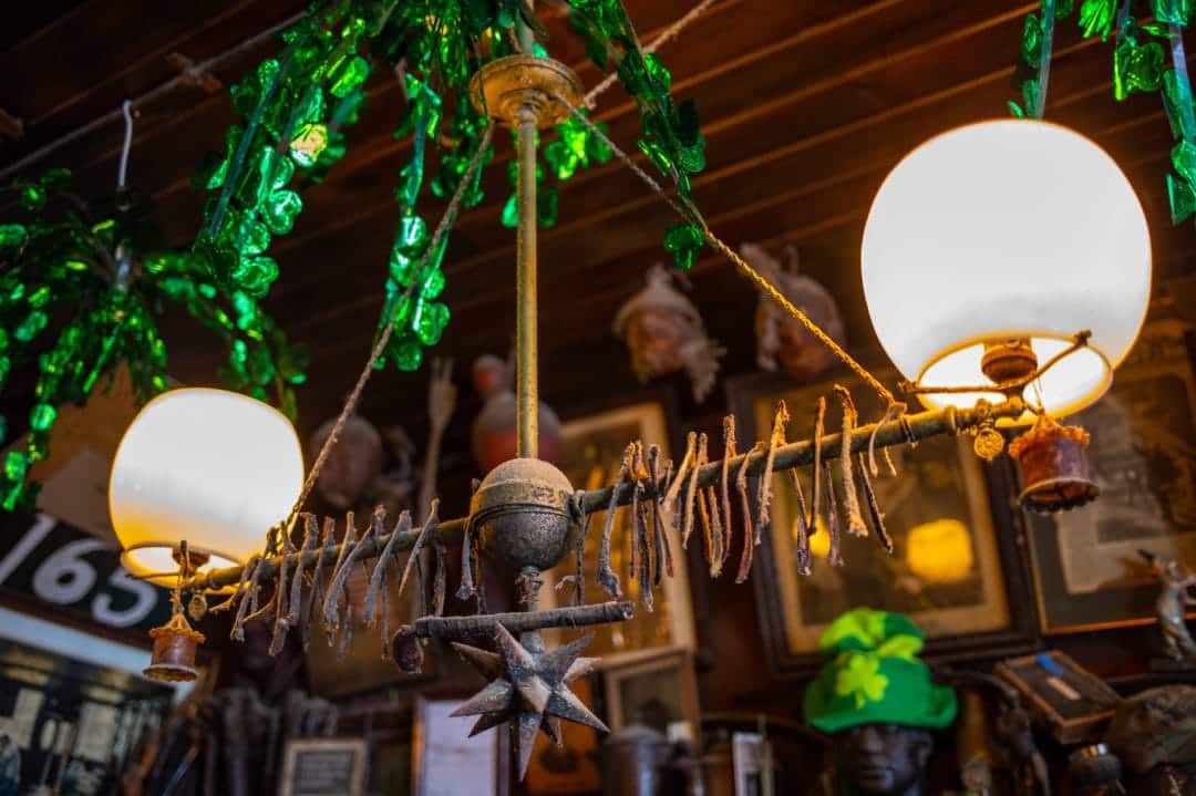 Dusty wishbones hang above the bar on a gas lamp