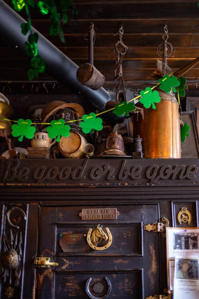 An old ice chest is piled with dusty artifacts