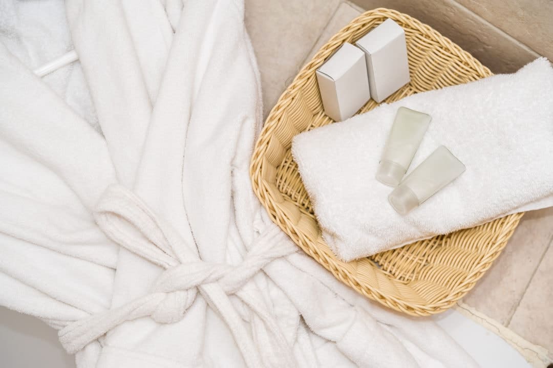 Hotel robe, soaps and shampoo bottles