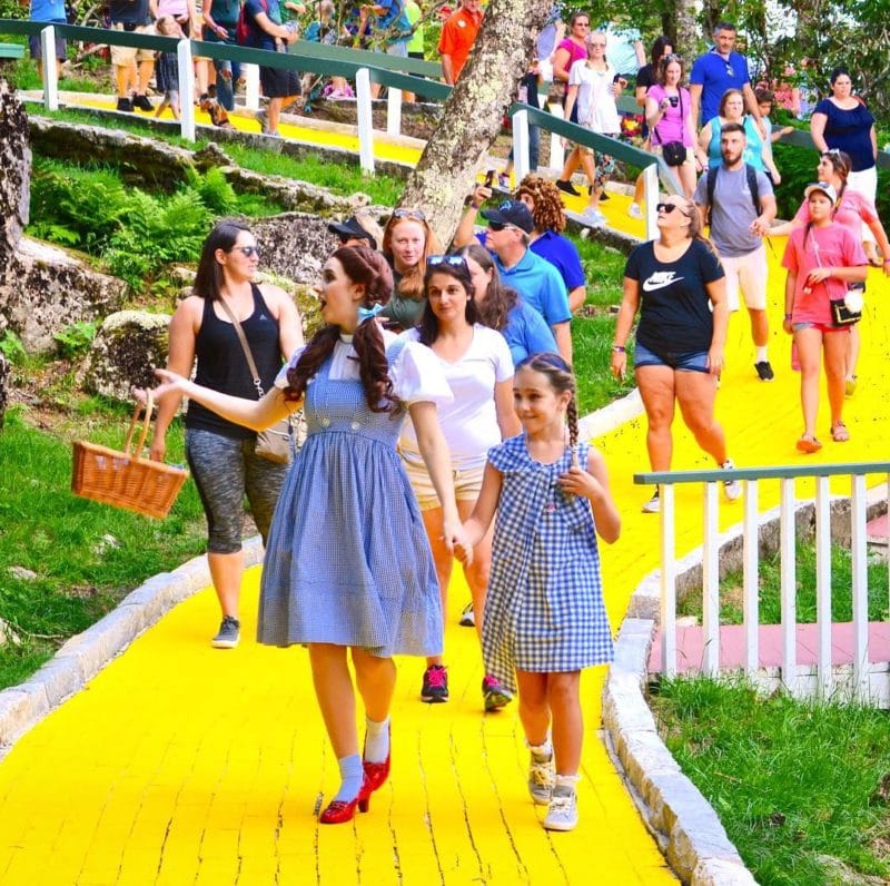 A ruby slipper-clad Dorothy leads a tour during Journey with Dorothy.