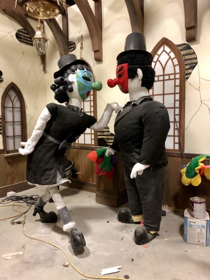 The interior of the haunted house features cartoon vignettes.