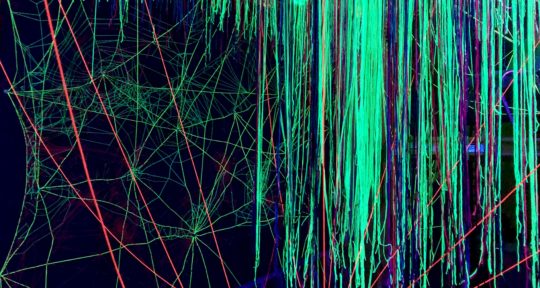 Otherworld imagines a future where virtual reality tourism is equal parts creepy and colorful