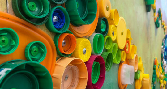 Ingrid Goelz takes recycling to the next level in her latest mural—made with discarded plastic lids