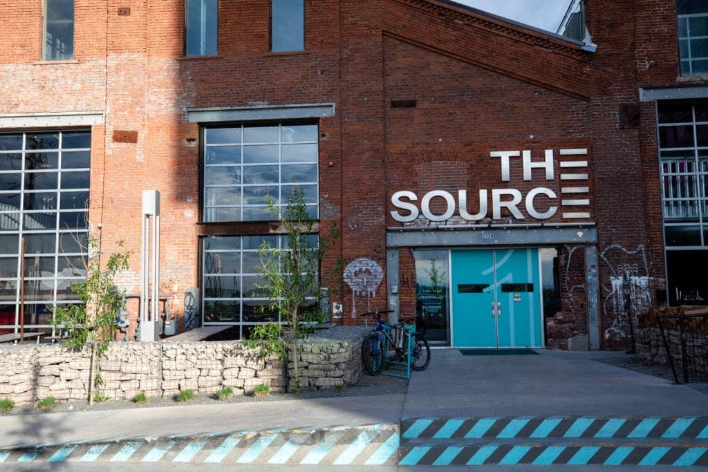 The bright blue entrance to The Source