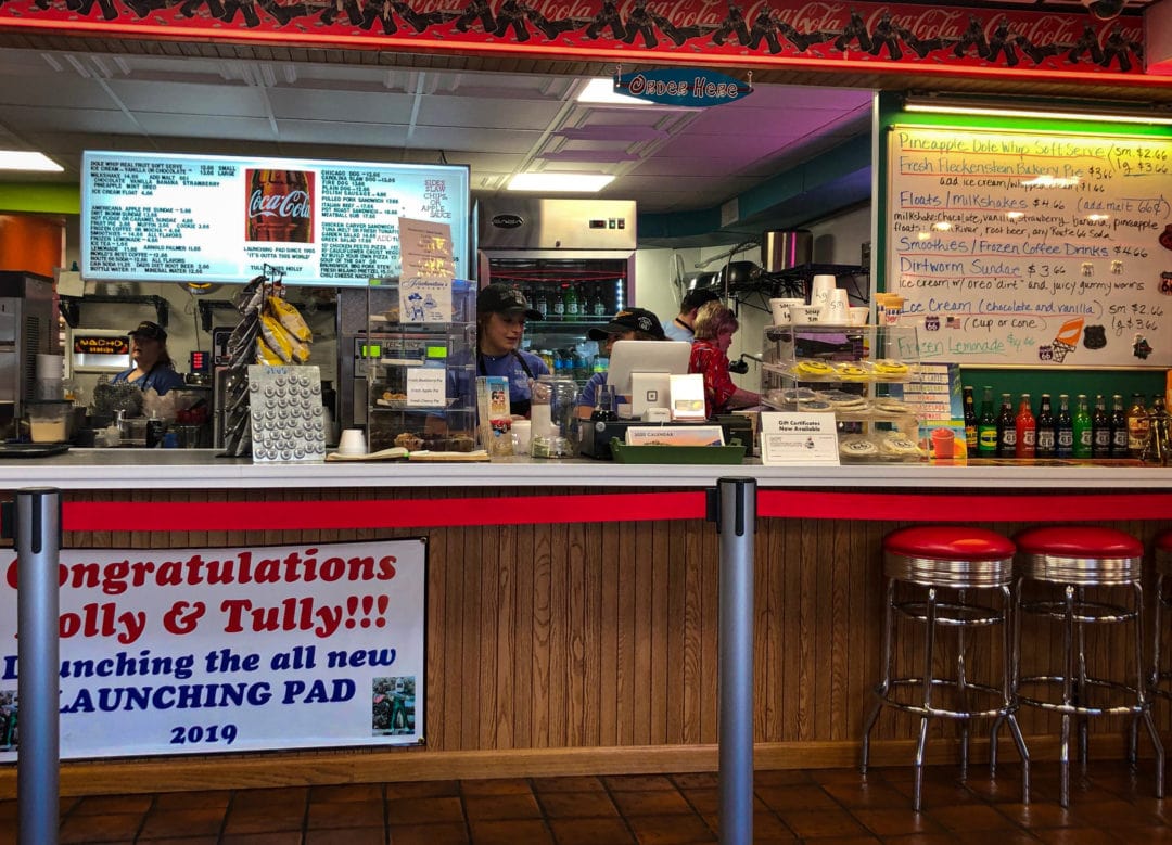 The front counter, and official reopening sign, inside The Launching Pad