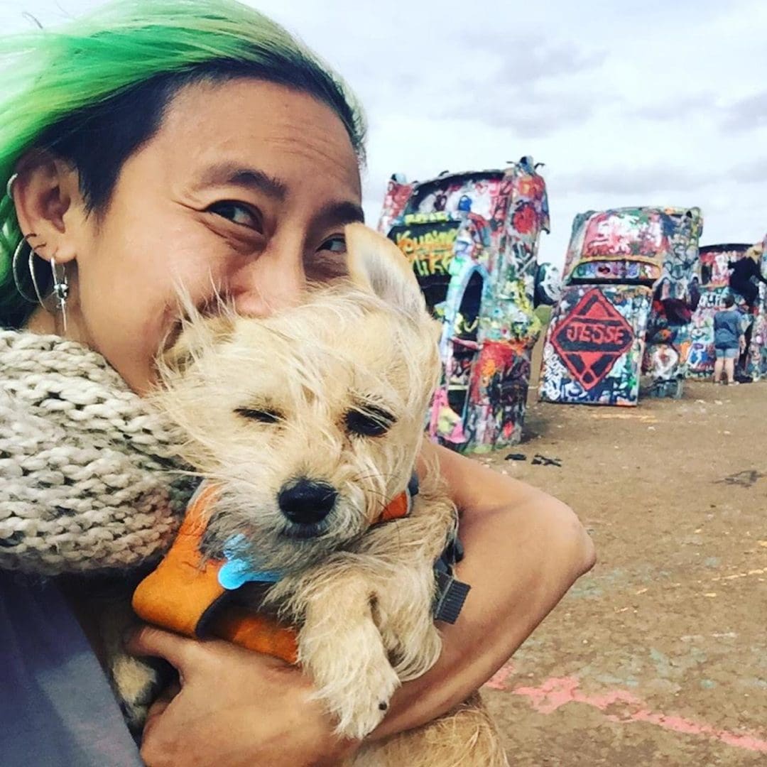 Khor and Bug pose for a photo in front of cadillac ranch