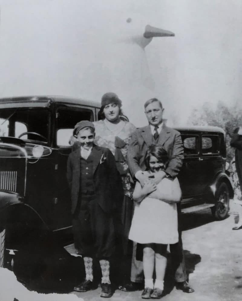 family in front of the duck