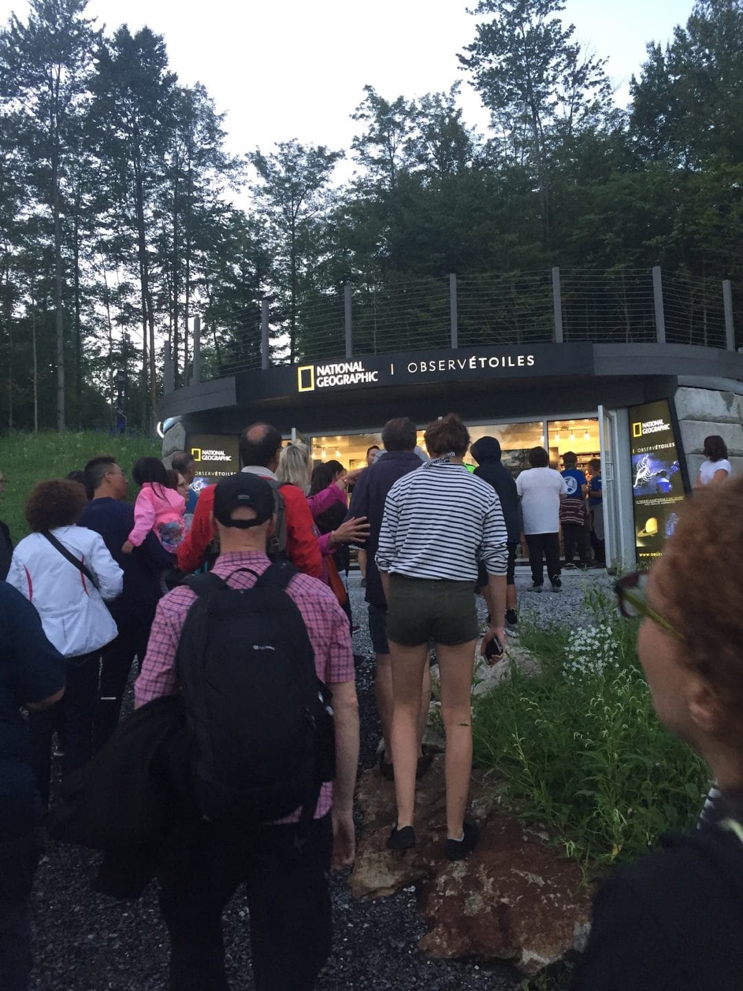 people stand in line to enter ObservÉtoiles