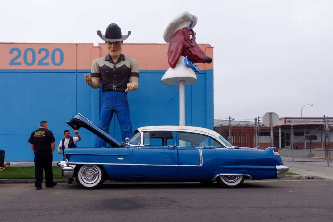 A cowboy Muffler Man and a Doggie Diner head.