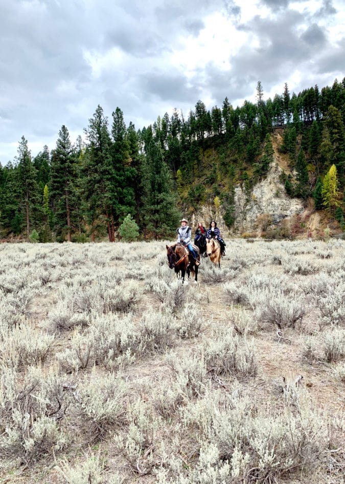 Women on horseback.