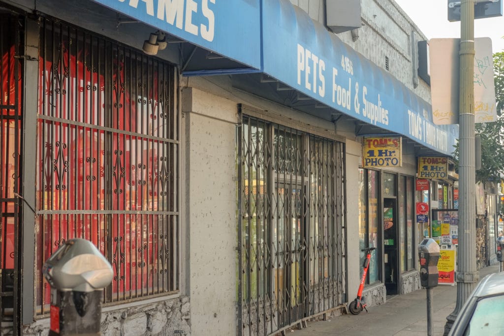 The studio is wedged between other mom-and-pop stores, including a pet supply business.