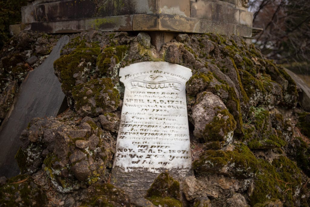 Intricate headstones set into a monument.