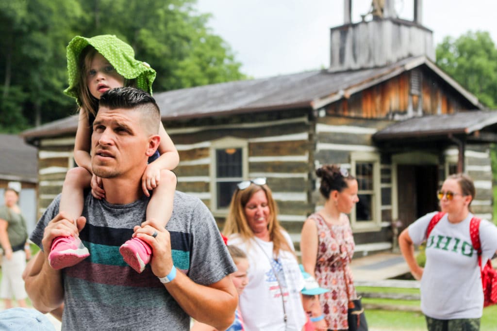 Glenn Dillon and his daughter Gretta wait in line during the Summer Ice Cream Festival.