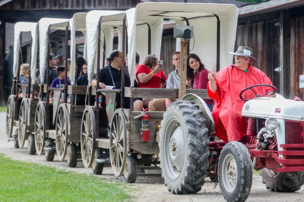 Tractor-pulled wagons patrol the Heritage Farm grounds.