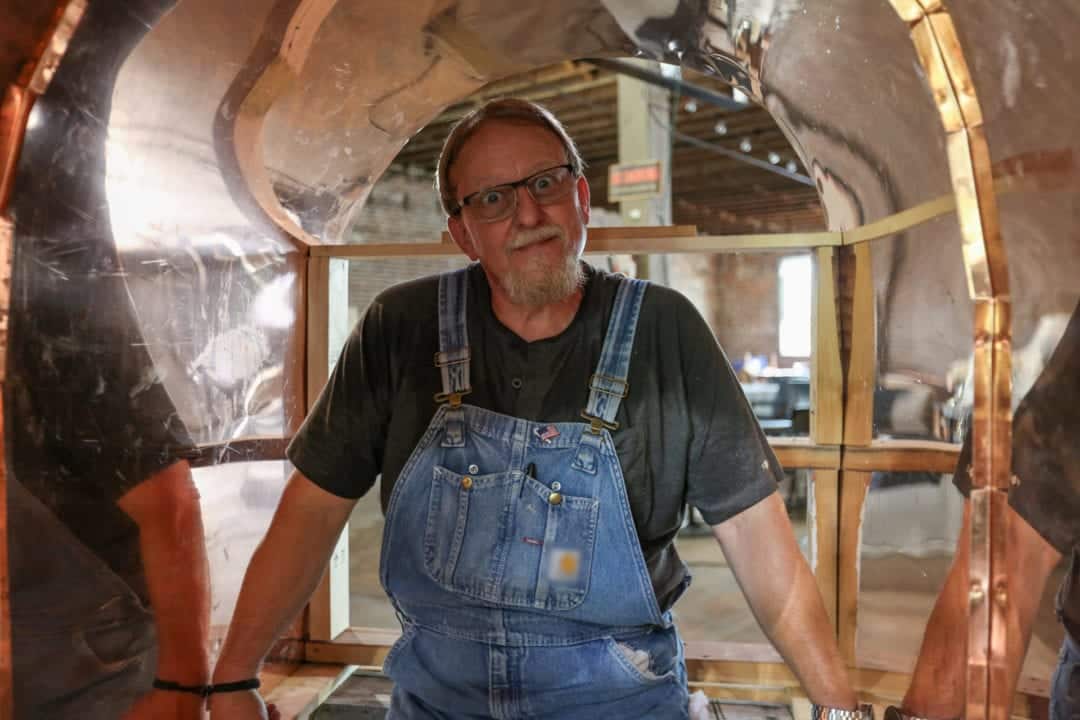 Manes in his signature overalls