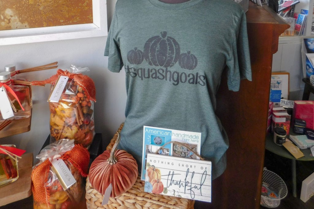 Lu Lu’s retail shop packed with pumpkin-related candles, home décor, and T-shirts.