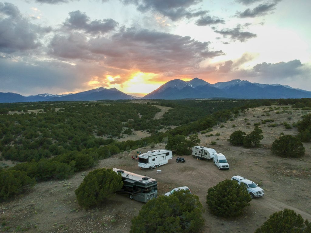 Group of RVs parked together in desert with no hookups