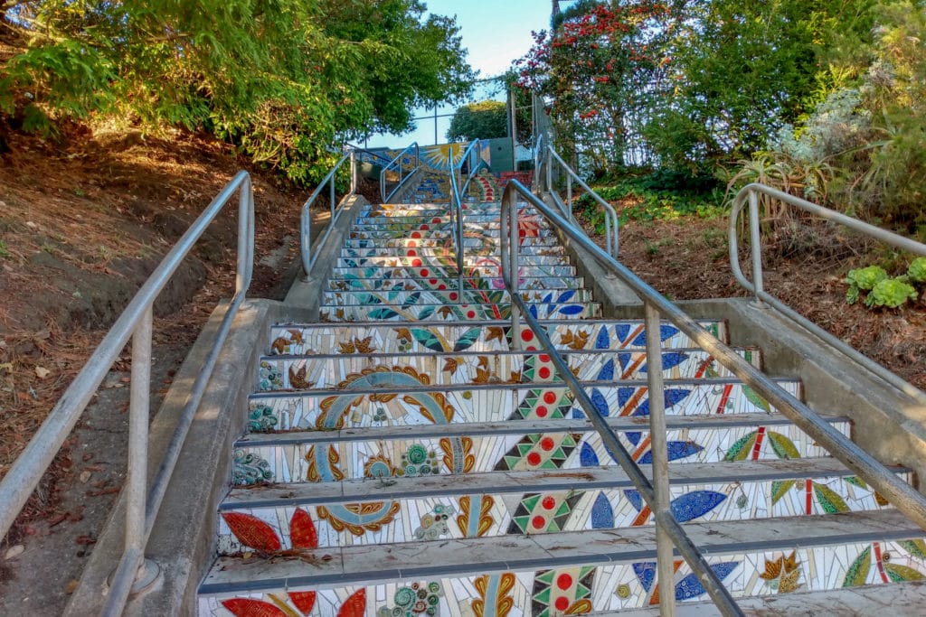 Mosaic tiled staircase with a floral and decorative motif