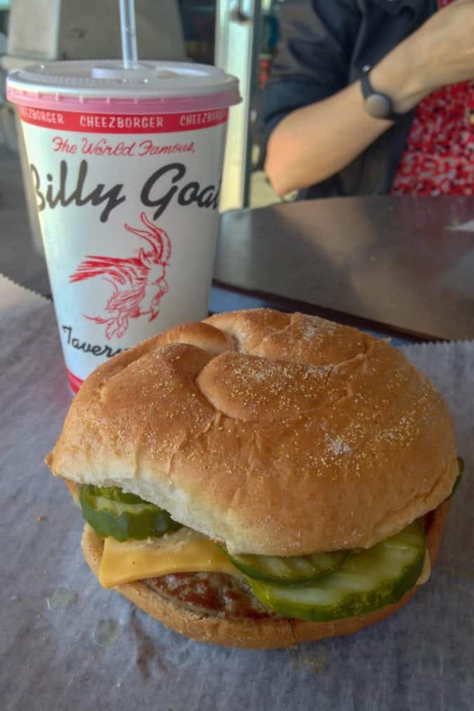 a cheeseburger with pickles 