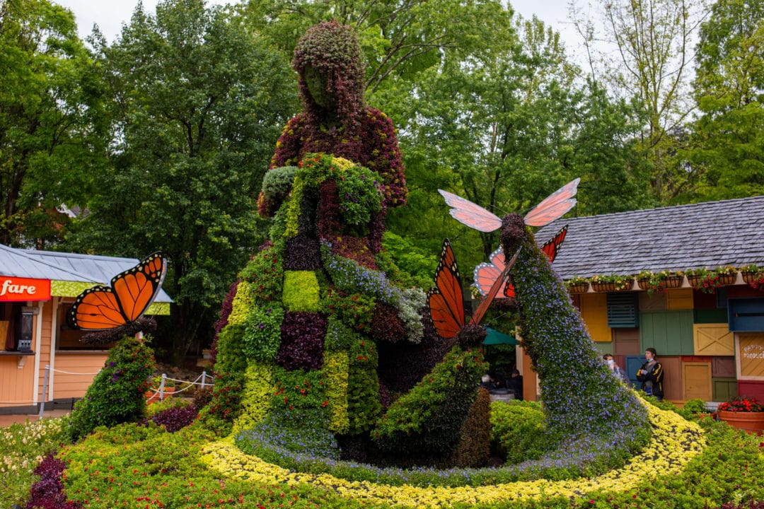 A flower sculpture references the 1971 song "Coat of Many Colors."