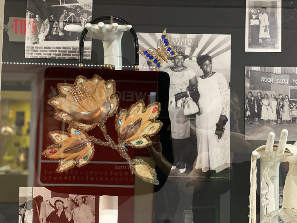 a museum display featuring photos of glamorous black women