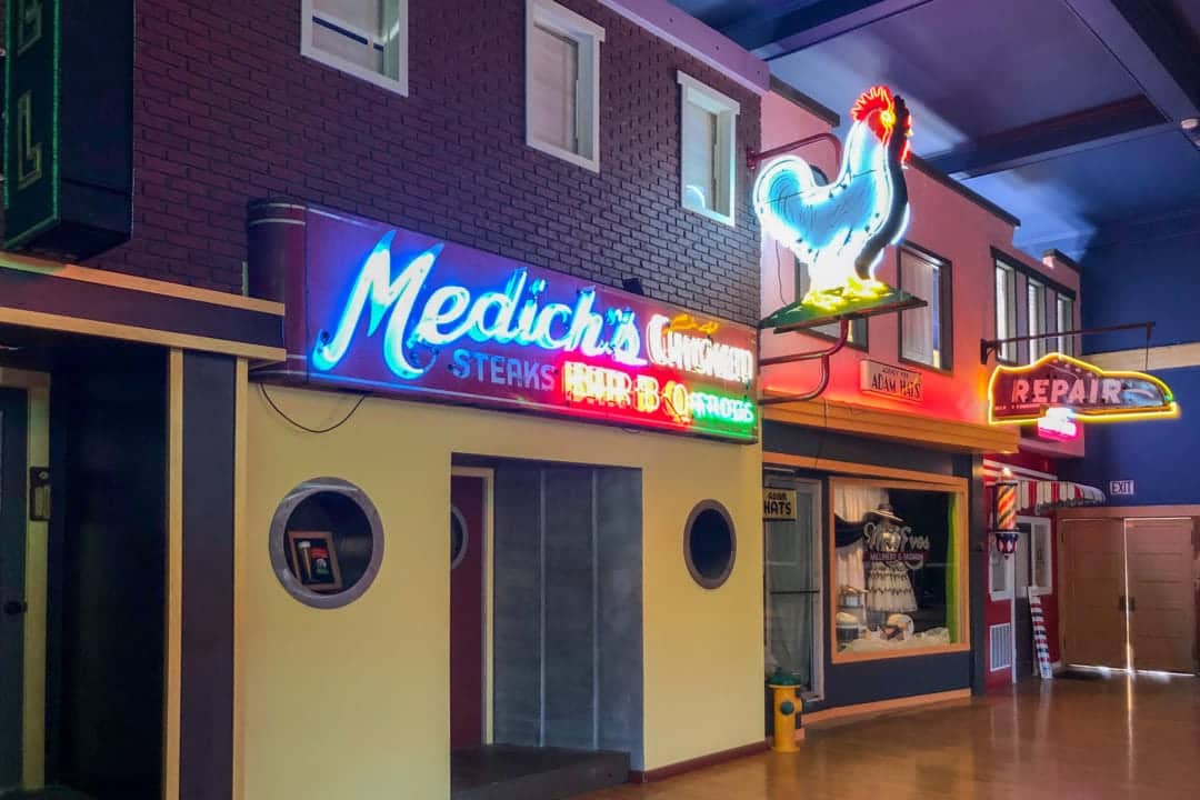 a main street facade featuring neon signage