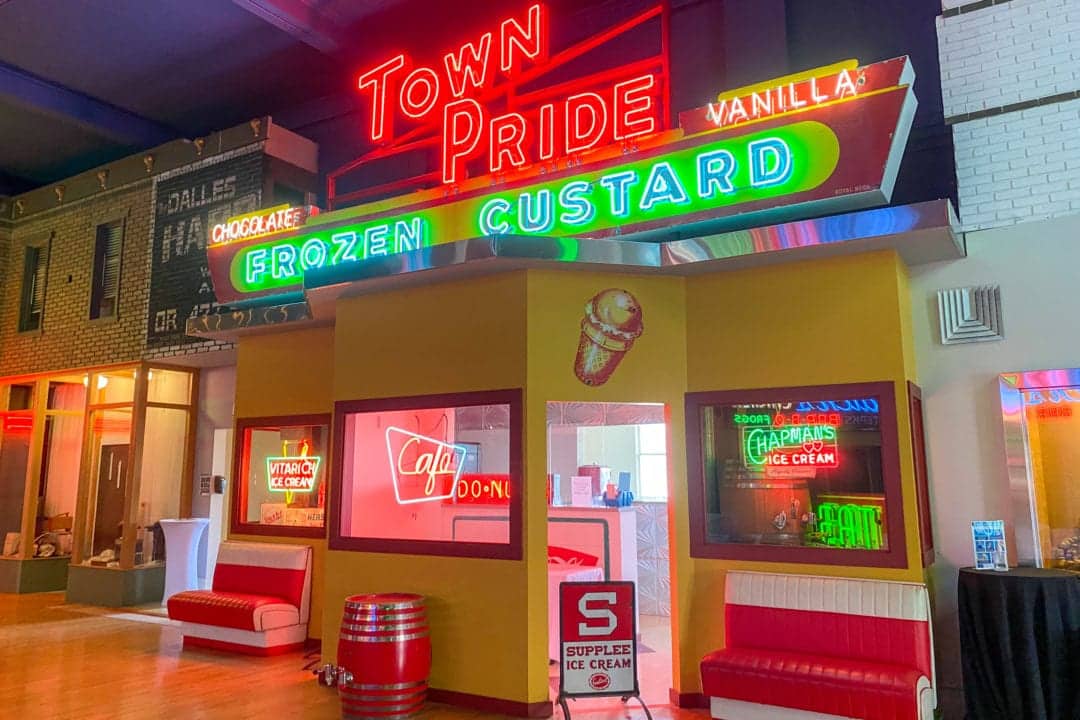 a cafe facade featuring neon signs