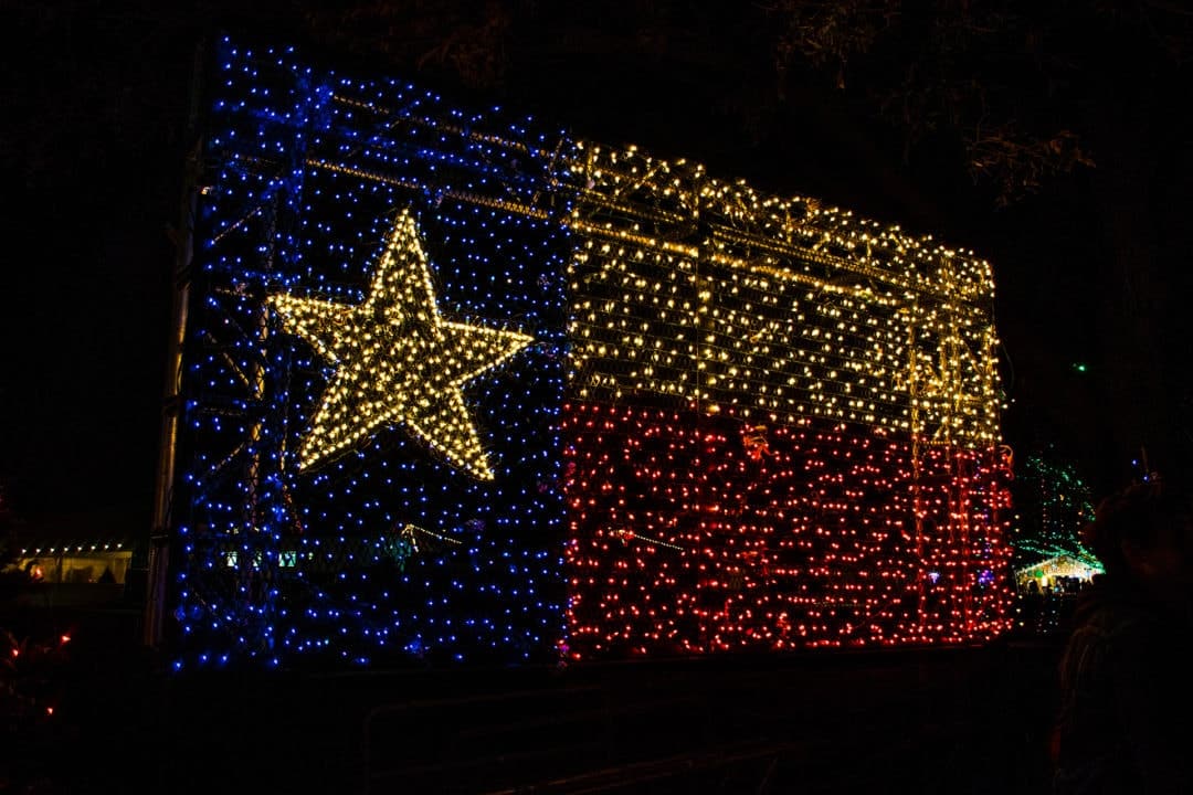 Texas flag illuminated in Christmas lights.