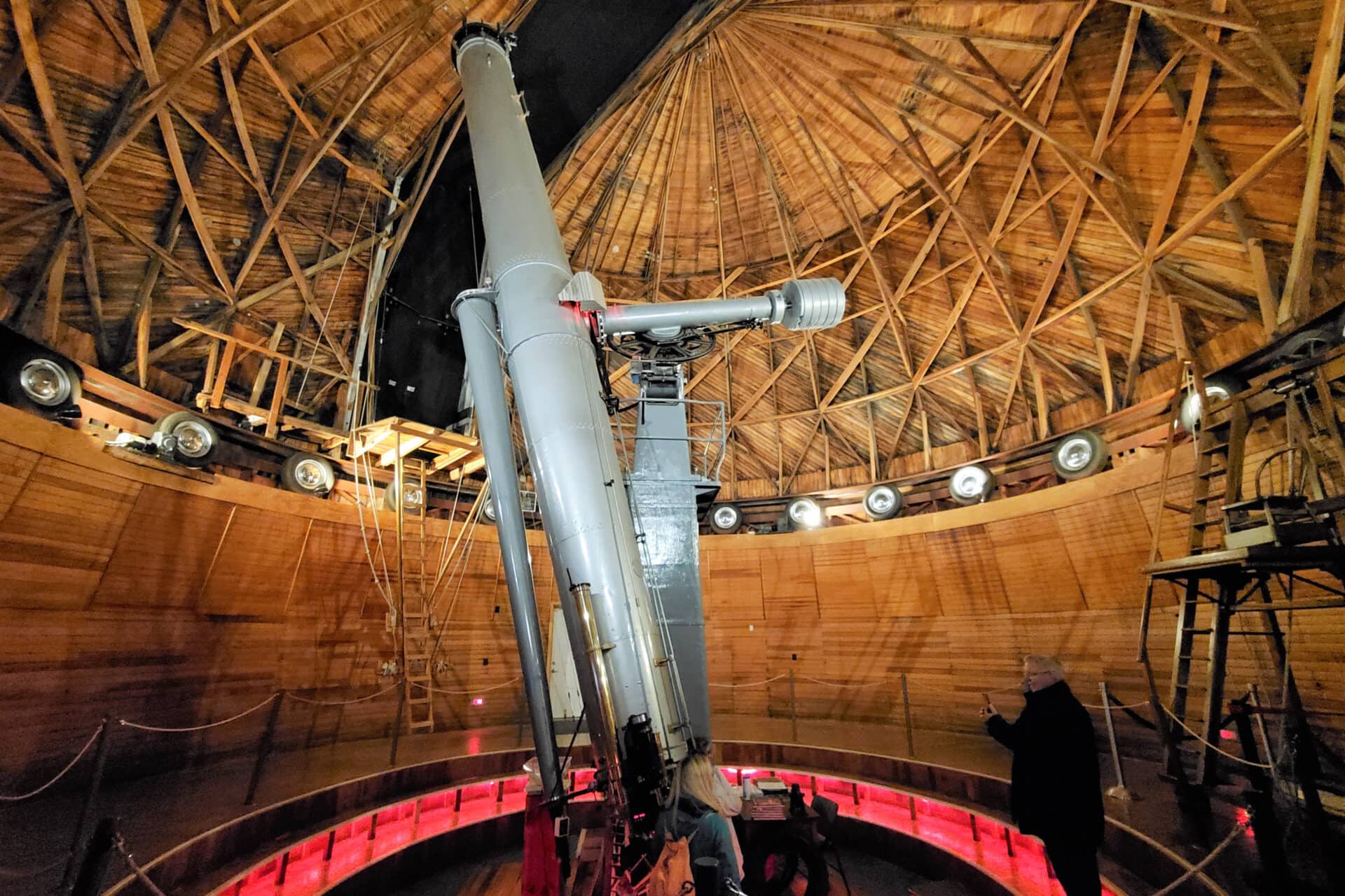 a large wooden domed observatory houses a large telescope