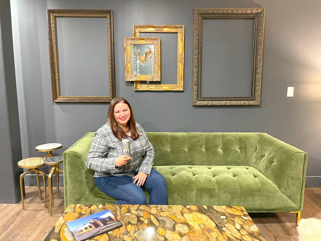 green velvet couch holding a can of beer, 42 north brewing company