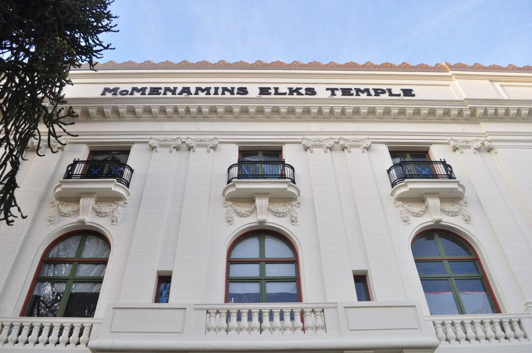 a white, ornate classical building with arched windows, mcmenamins elks temple