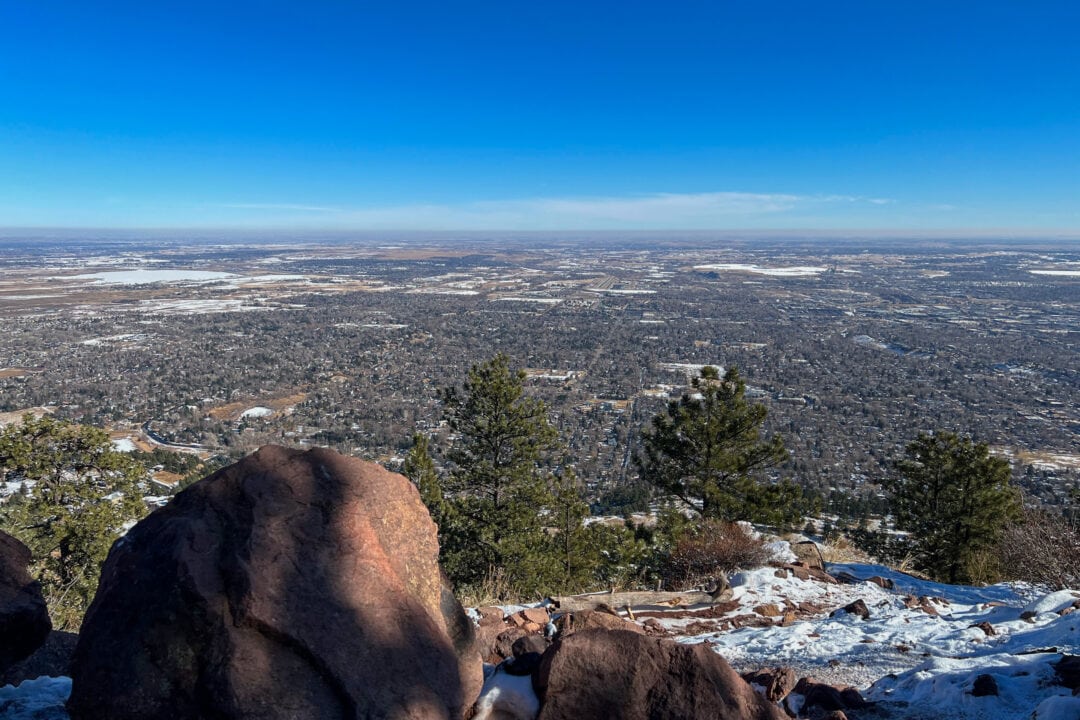 a view from on top of a mountain under a clear blue sky