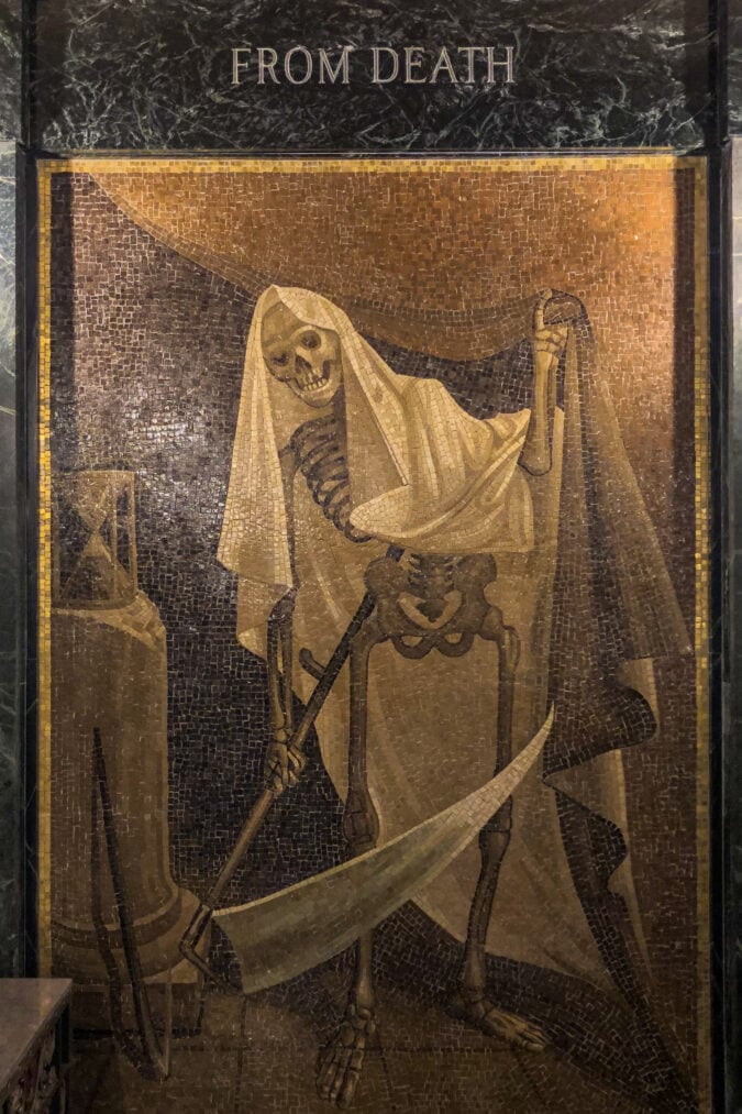 a mosaic of a skeleton with a scythe that says "from death"
