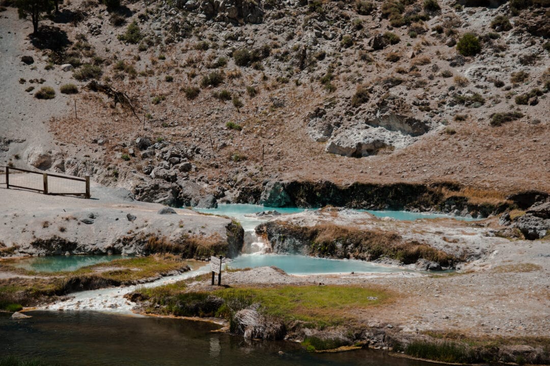pools of turquoise water in a desert landscape