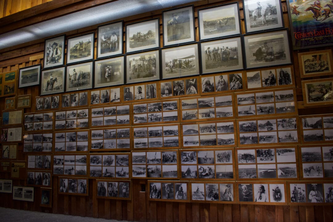 A large wall is filled top to bottom with historical photos.