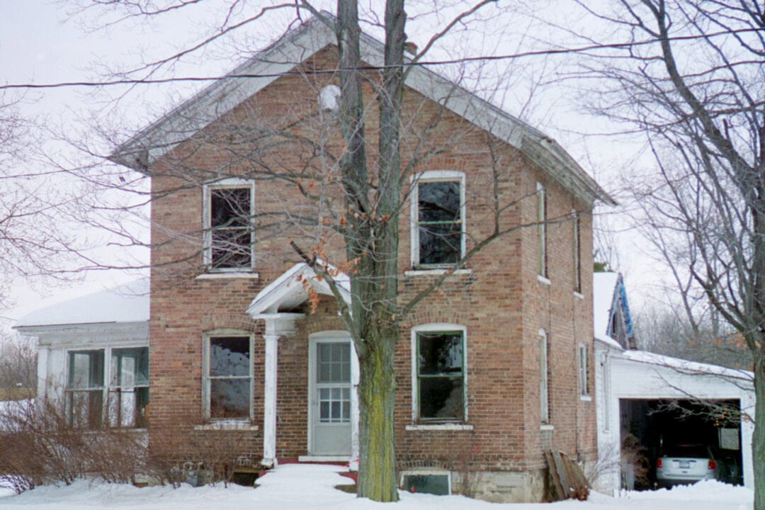 An exterior photo of the Harriet Tubman home reveals it's a two-story red brick house.