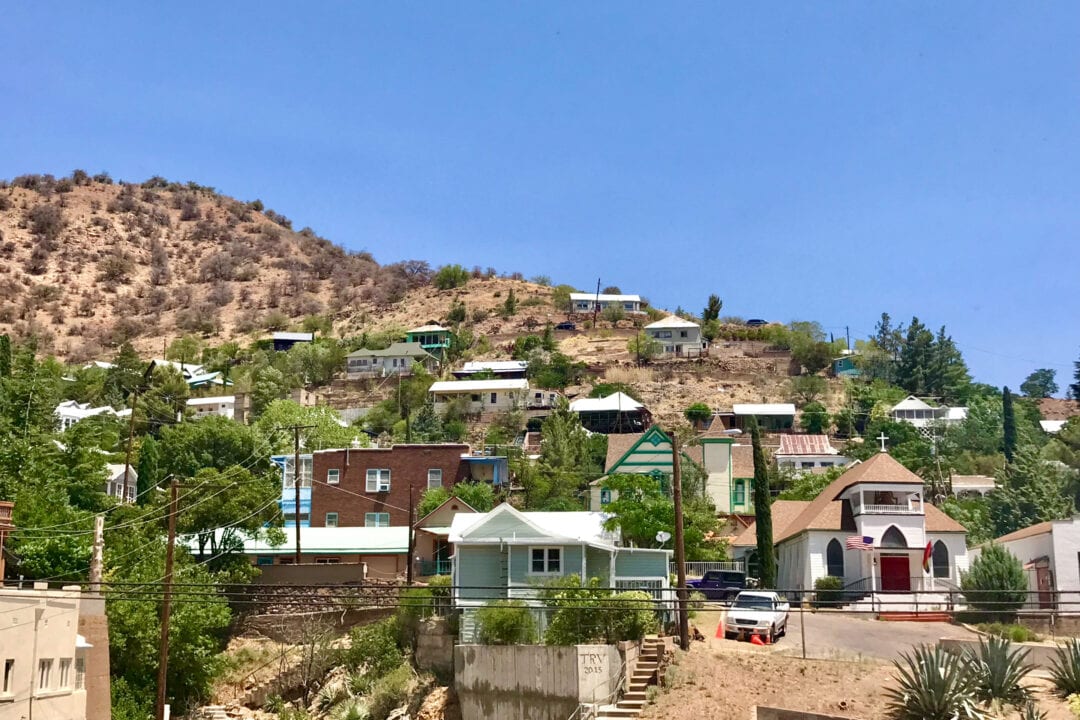 Houses are staggered upon rolling hills in Arizona