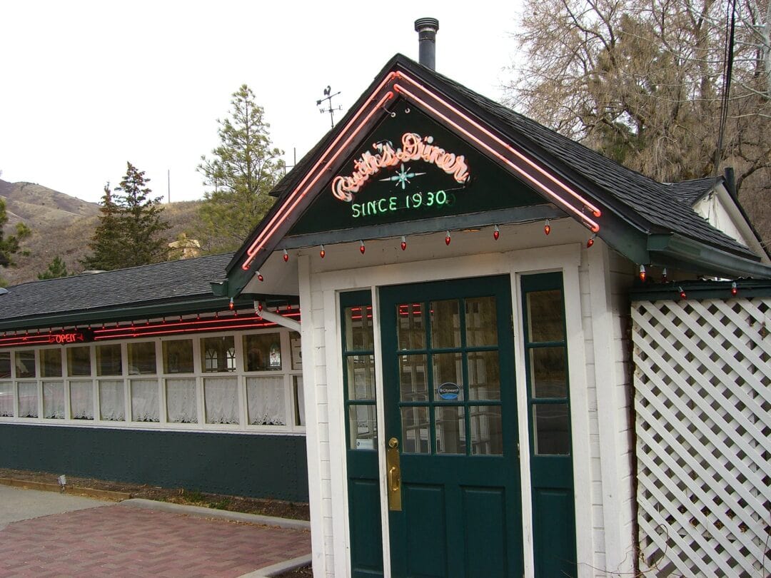 Entrance to diner with neon sign that reads "Ruth's Diner. Since 1930"