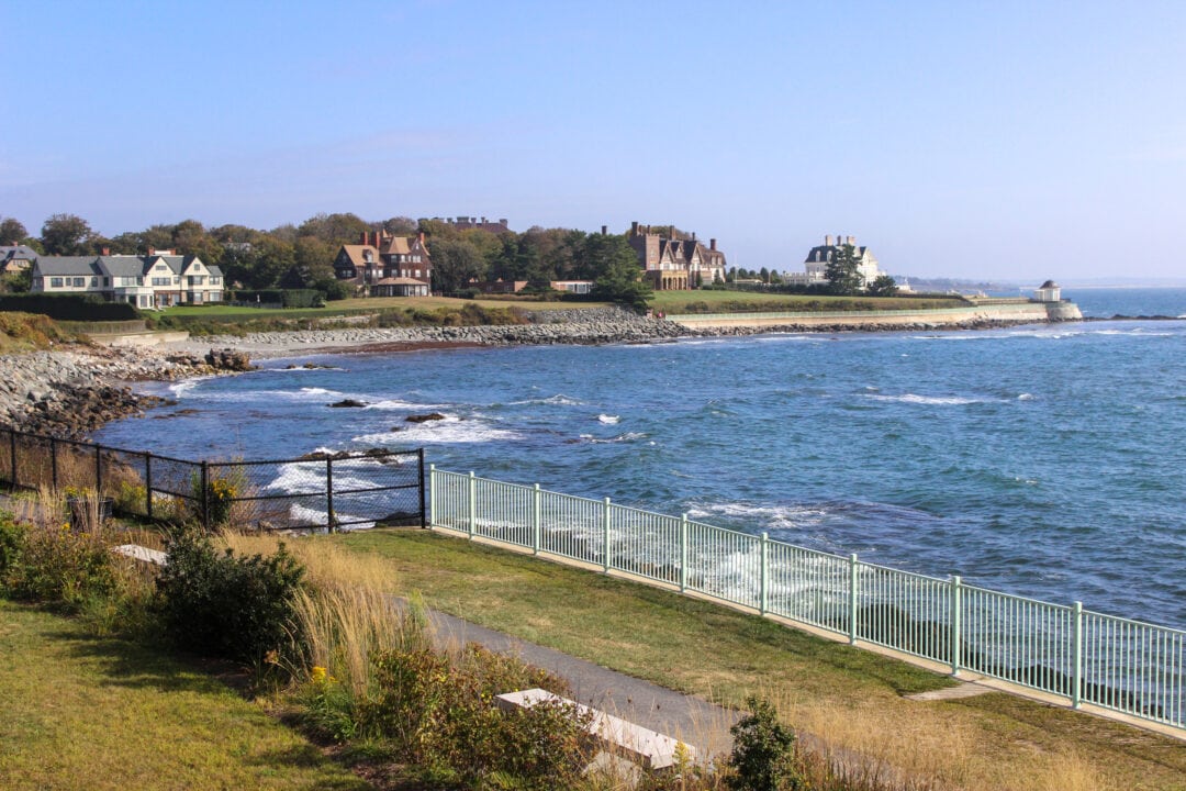 houses dot a rocky shoreline overlooking the ocean