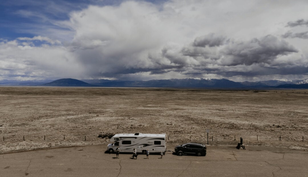 Aerial view of an RV motorhome towing an SUV