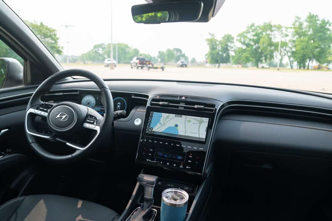 the interior of a car showing the driver's side and center console