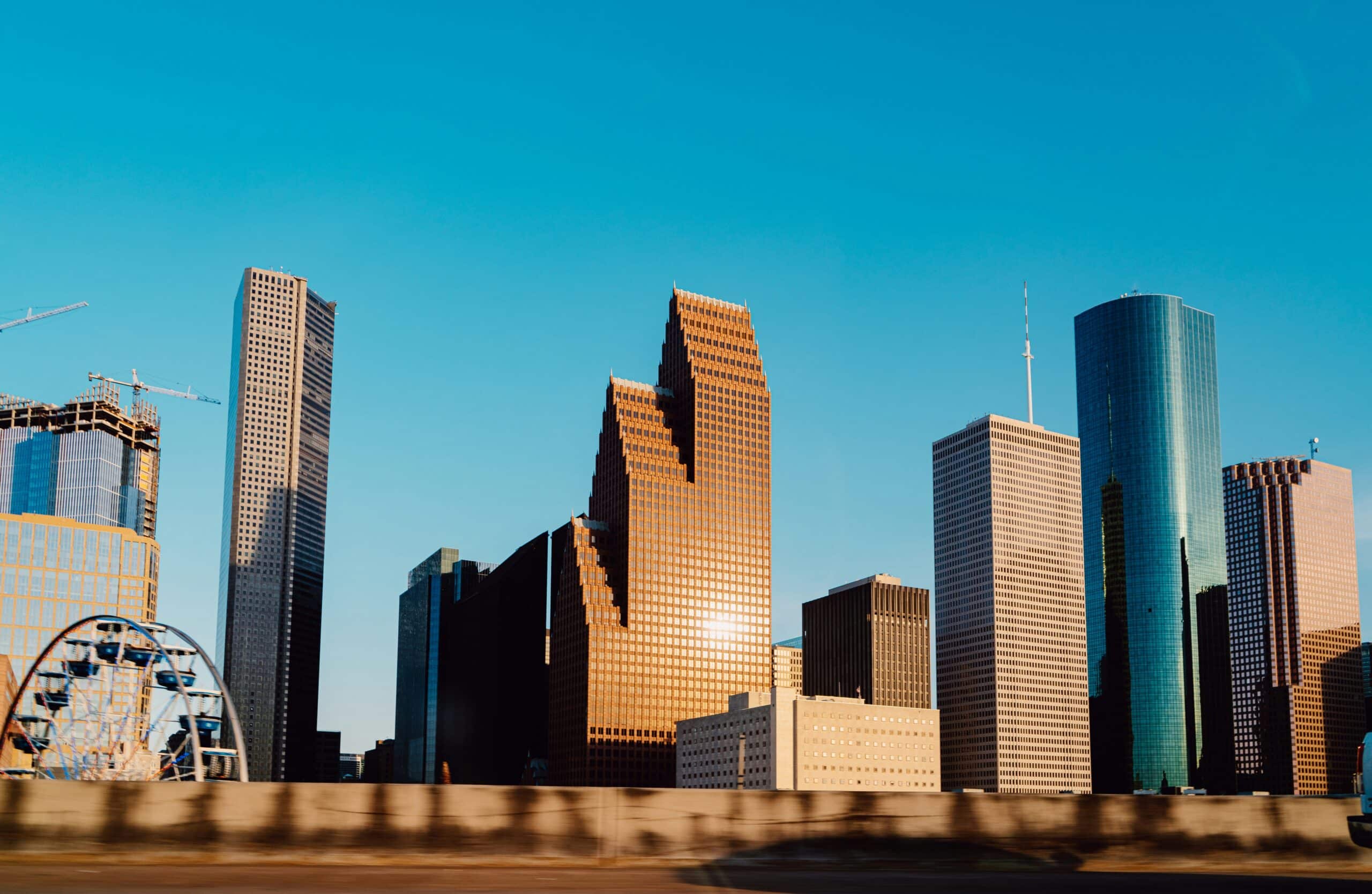 Houston Skyline, Photo by Adrian Newell and Unsplash